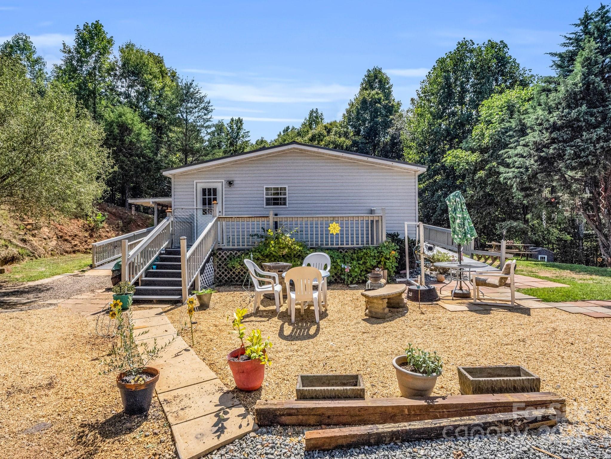 282 Reagan Lane Bostic, NC 28018 - Photo 6 of 34 a view of a house with backyard and sitting area