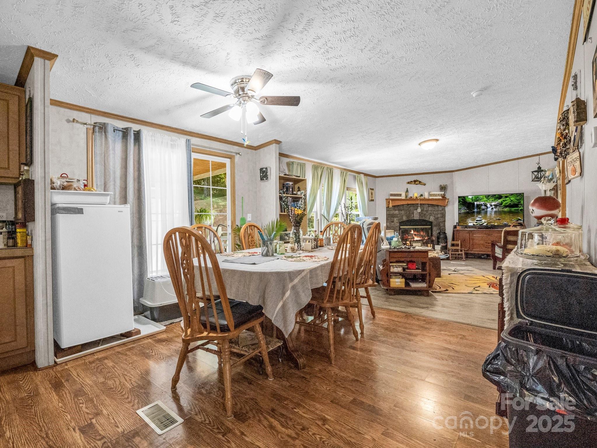 282 Reagan Lane Bostic, NC 28018 - Photo 10 of 34 a view of a dining room with furniture window and wooden floor