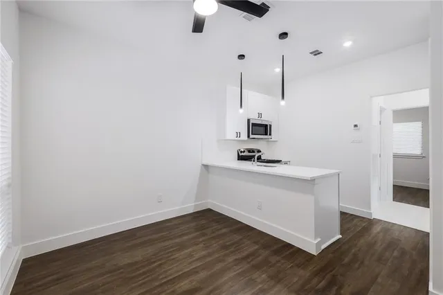 a view of cabinets and wooden floor