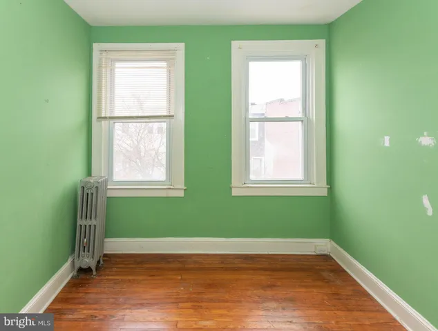 a view of a small space with wooden floor