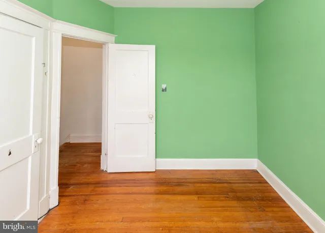 a view of room with window and hardwood