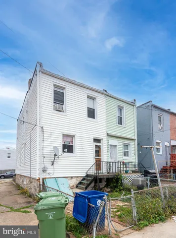a view of a street with a cars parked on the road