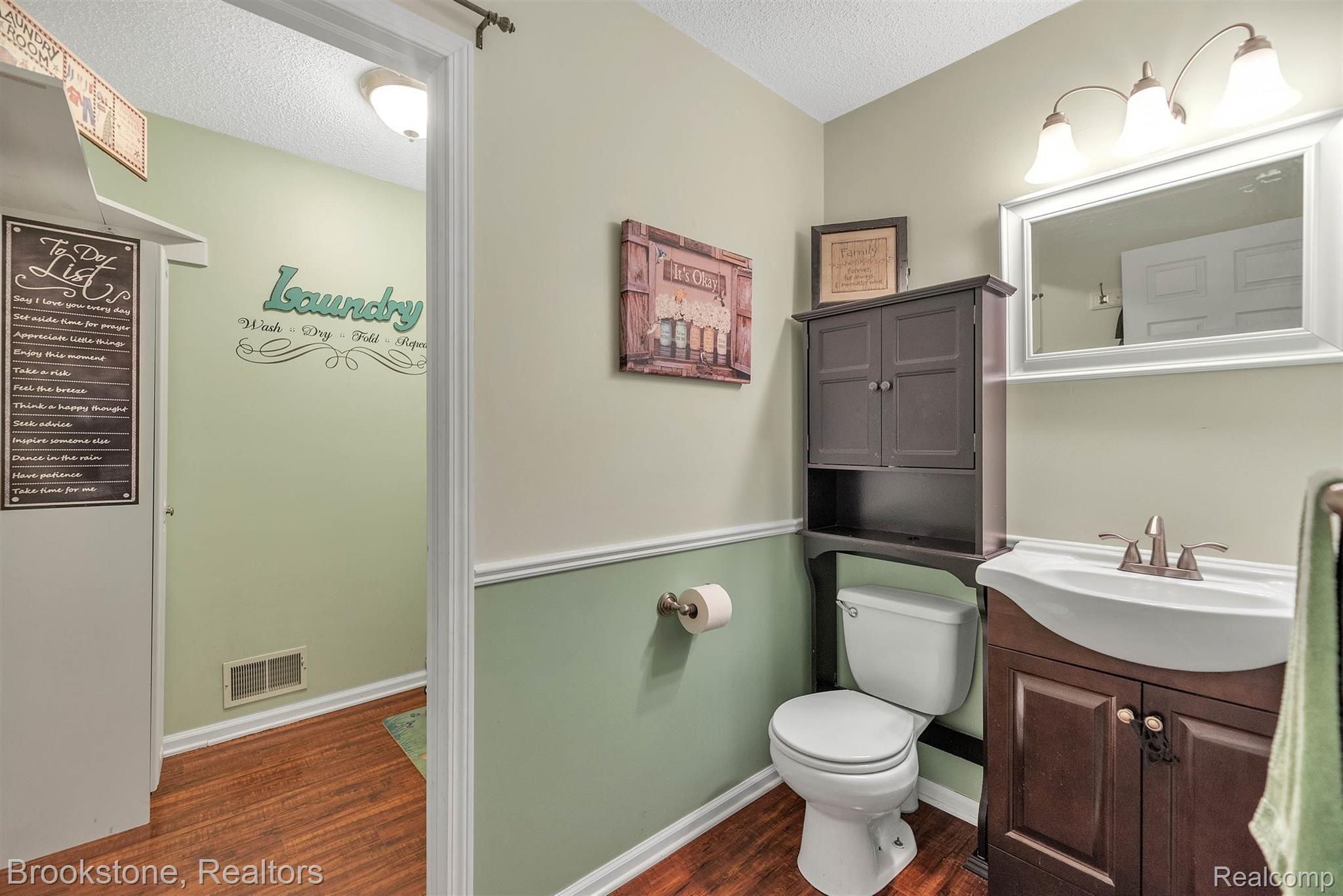 3881 East Hunters Creek Road Metamora, MI 48455 - Photo 17 of 55 Half bath/laundry area