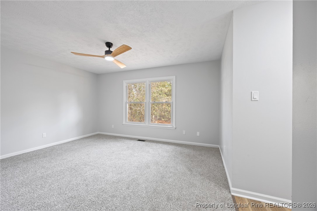 610 Duncan Road Spring Lake, NC 28390 - Photo 17 of 34 an empty room with windows and fan