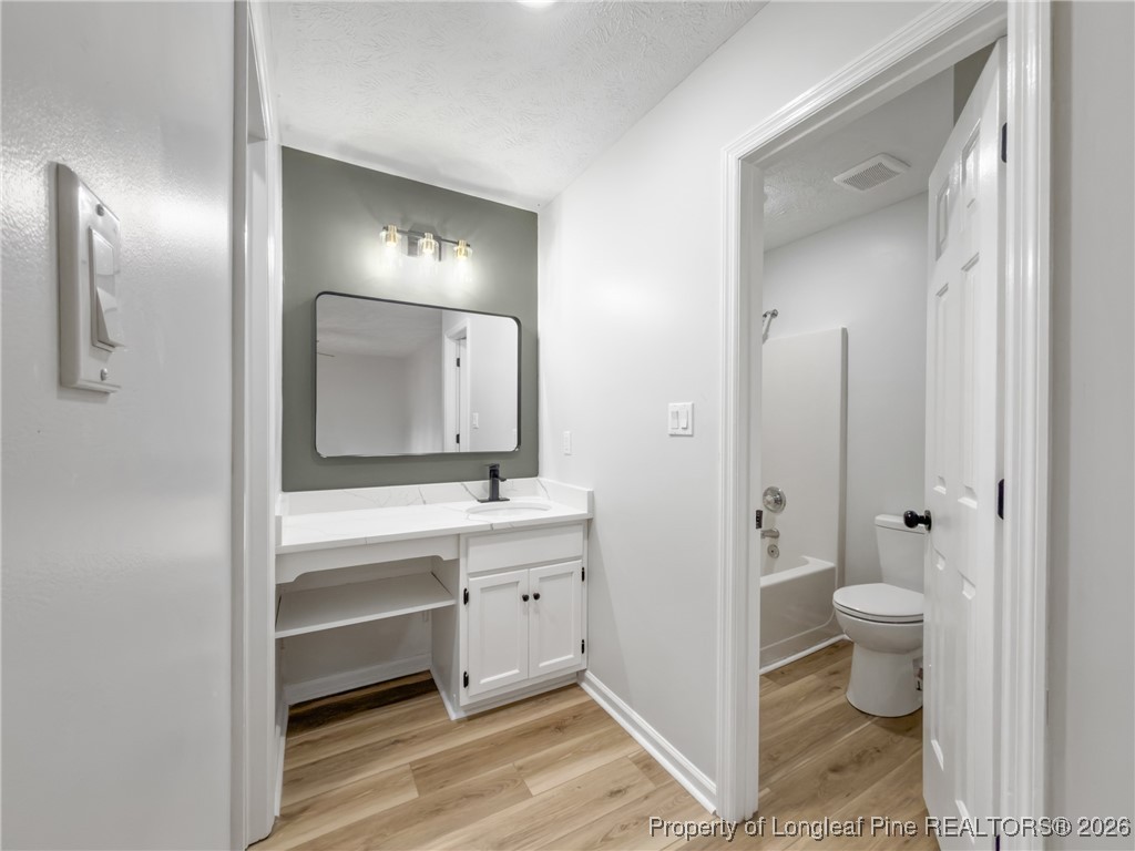610 Duncan Road Spring Lake, NC 28390 - Photo 20 of 34 a bathroom with a toilet sink and mirror