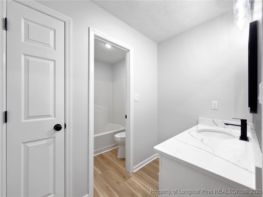 610 Duncan Road Spring Lake, NC 28390 - Photo 25 of 34 a bathroom with a sink toilet and shower