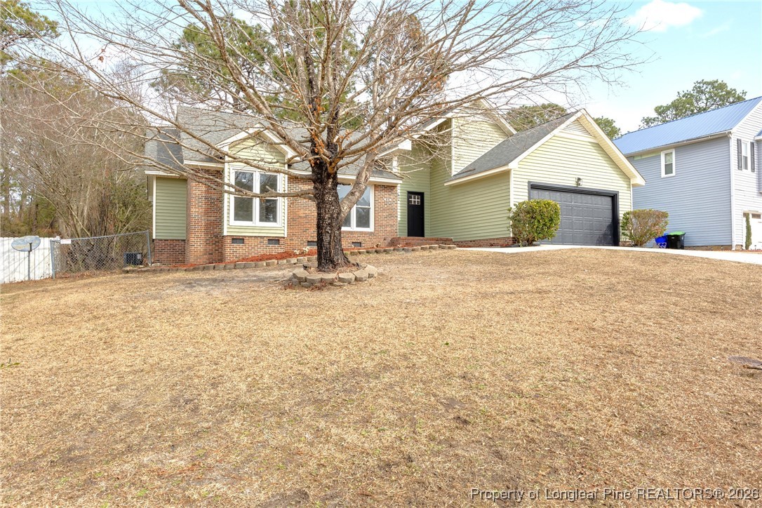 610 Duncan Road Spring Lake, NC 28390 - Photo 3 of 34 a house with trees in front of it