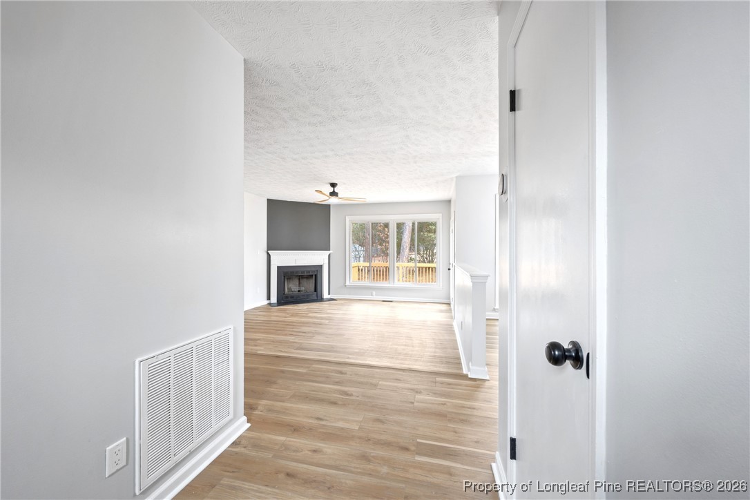 610 Duncan Road Spring Lake, NC 28390 - Photo 5 of 34 a view of a hallway with wooden floor and staircase