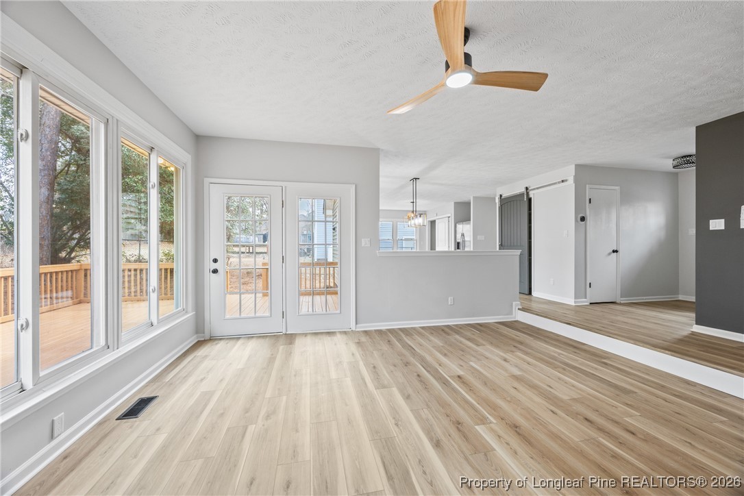 610 Duncan Road Spring Lake, NC 28390 - Photo 8 of 34 a view of an empty room with wooden floor and a window