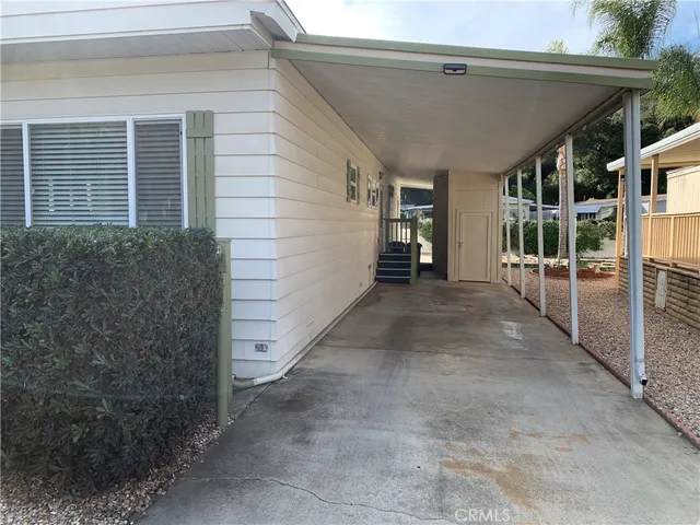 a view of house with backyard and garden