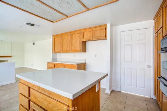 a view of kitchen island with furniture and wooden floor