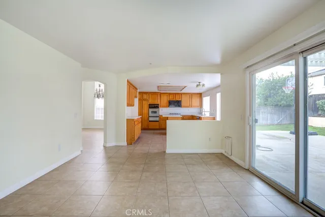 a view of a kitchen with furniture and a window