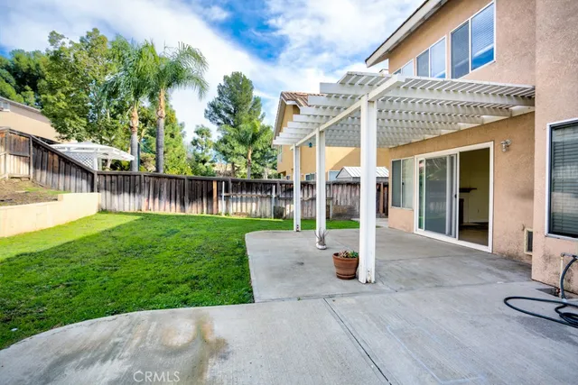 a view of a backyard with a patio