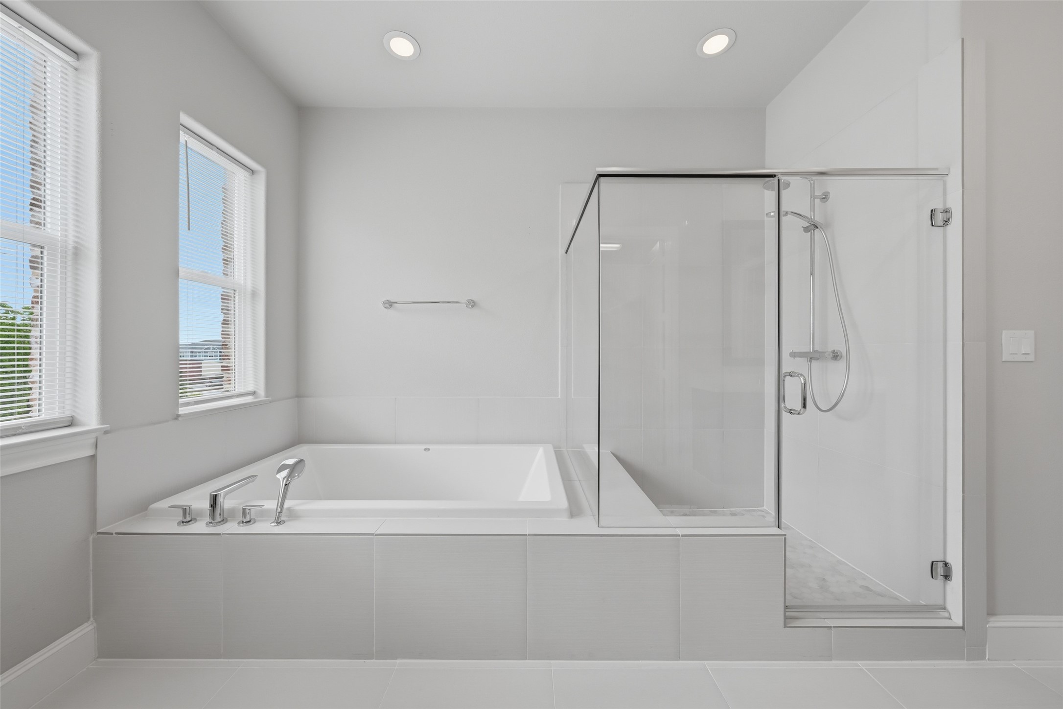 8612 Emnora Lane Houston, TX 77080 - Photo 28 of 45 a bathroom with a bathtub and a shower