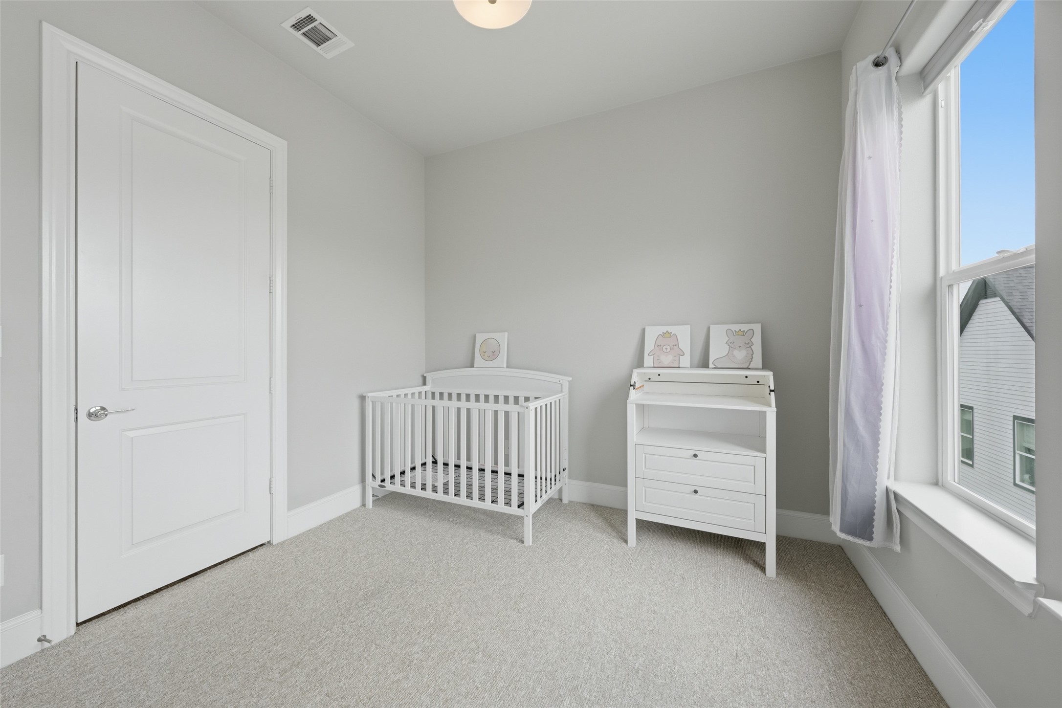 8612 Emnora Lane Houston, TX 77080 - Photo 32 of 45 a room with baby crib and dresser