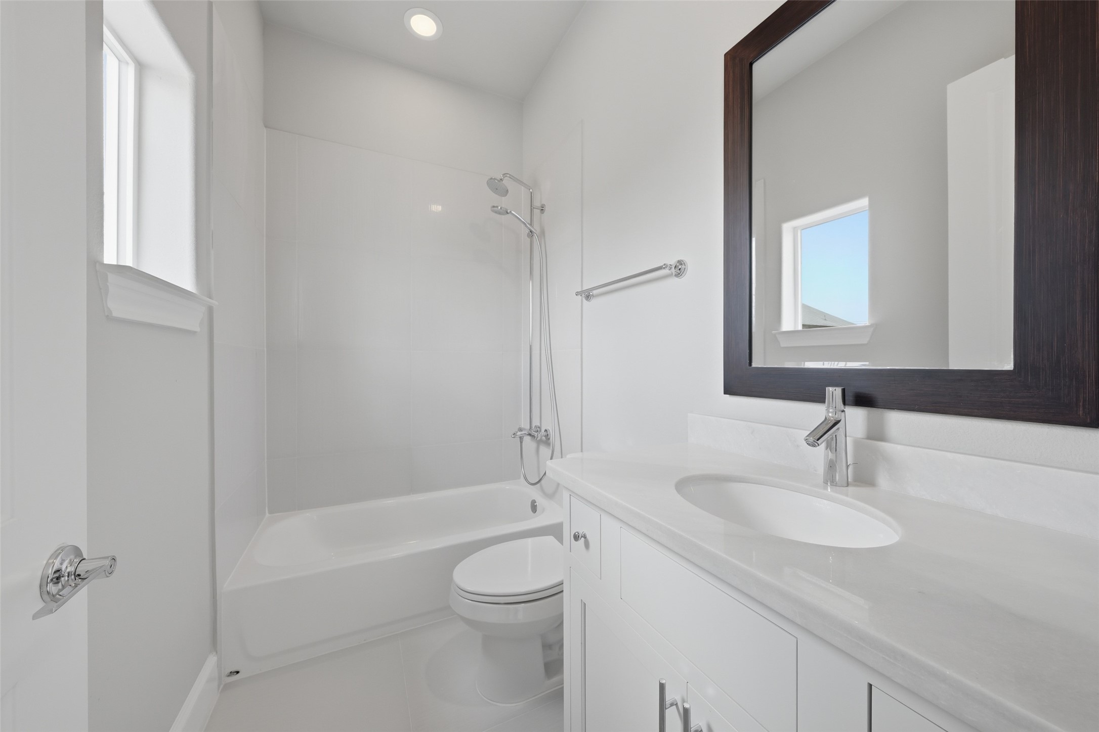 8612 Emnora Lane Houston, TX 77080 - Photo 34 of 45 a bathroom with a granite countertop sink toilet and shower