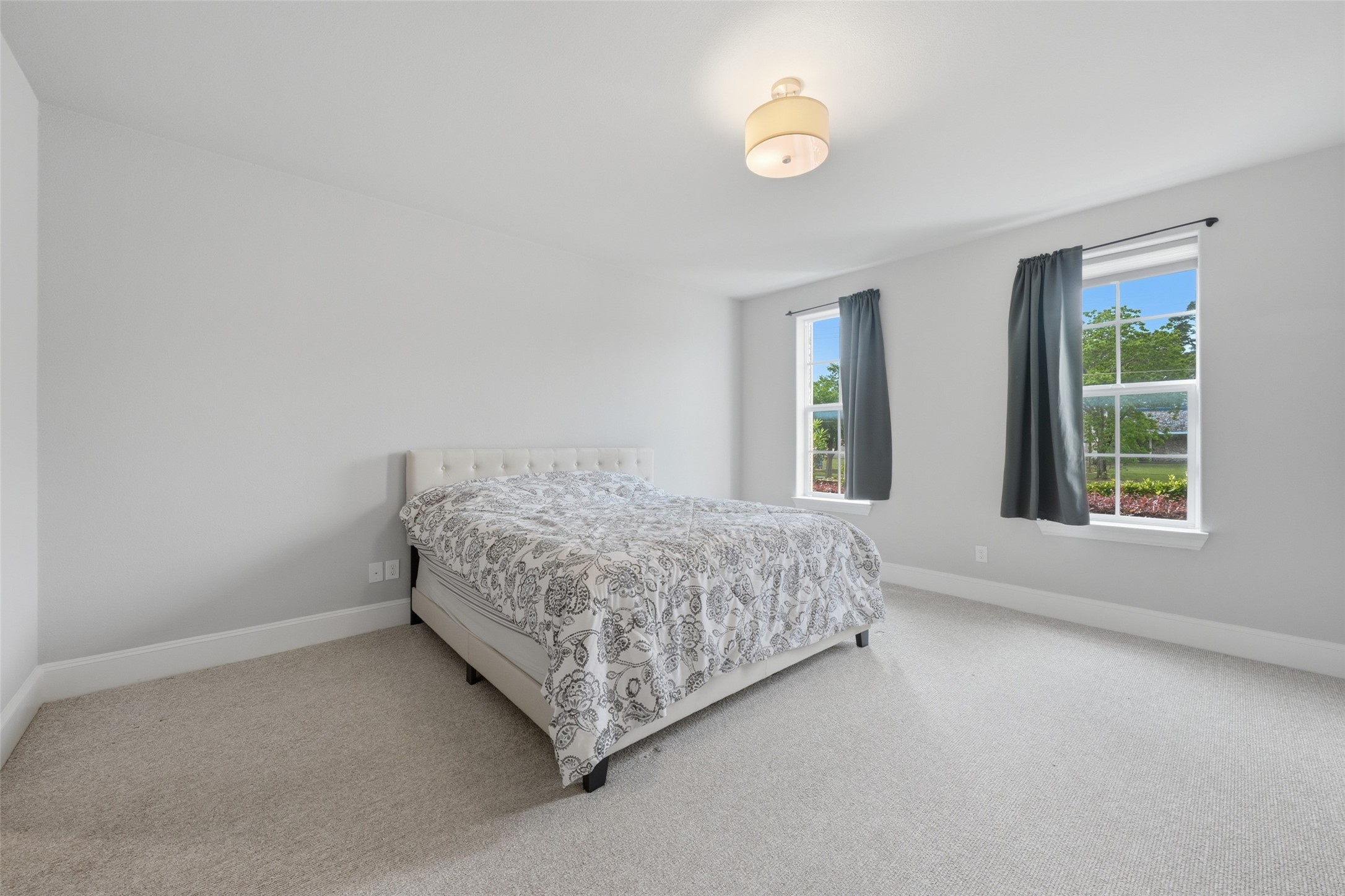 8612 Emnora Lane Houston, TX 77080 - Photo 5 of 45 a bedroom with a bed and a window