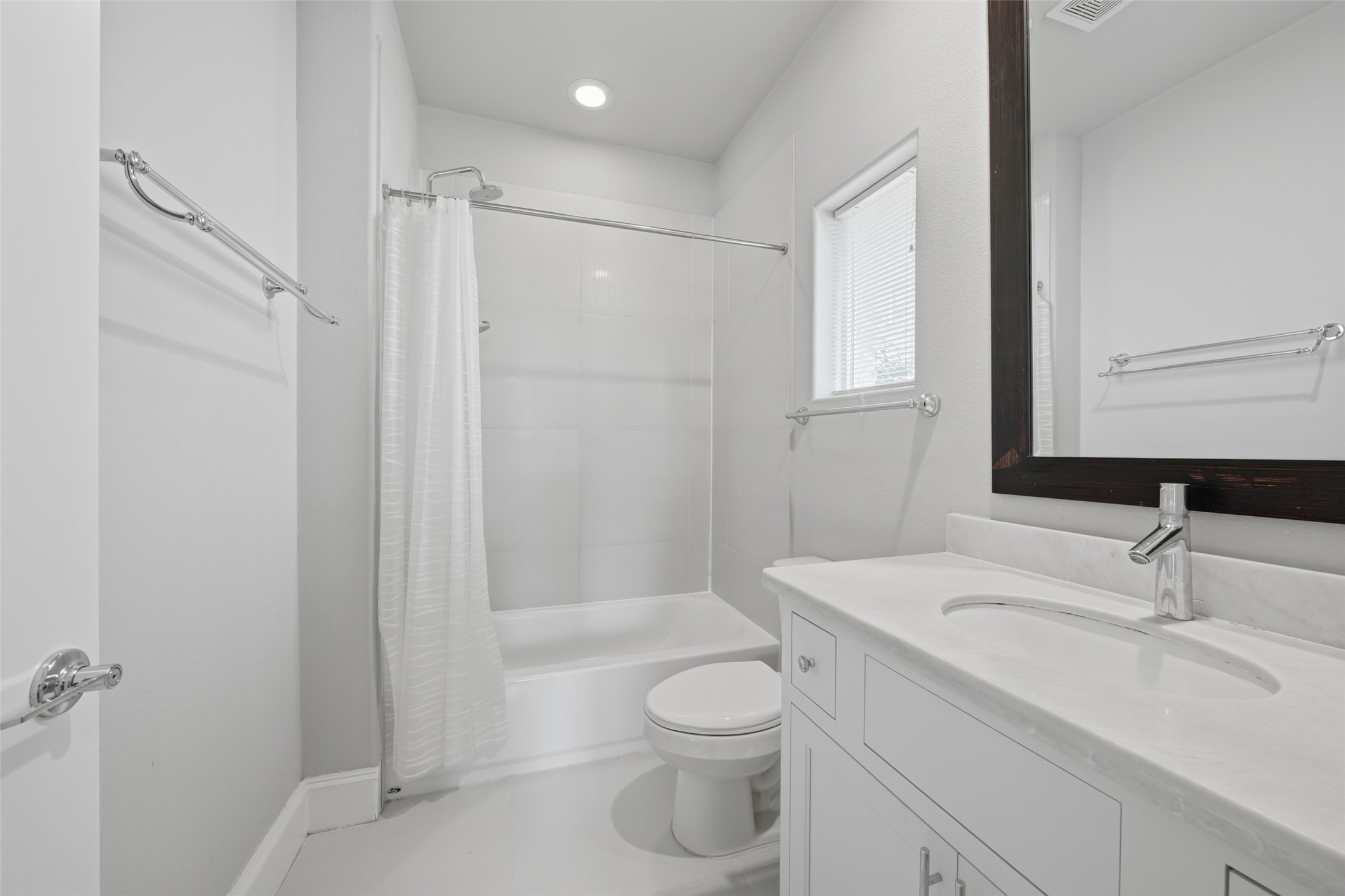 8612 Emnora Lane Houston, TX 77080 - Photo 7 of 45 a bathroom with a sink a toilet and shower