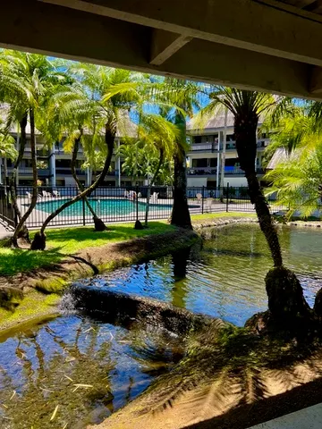 a view of a swimming pool with a patio