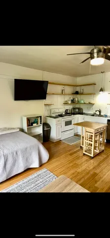 a view of kitchen sink and wooden floor