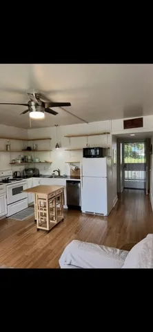 a view of a kitchen with furniture and a kitchen