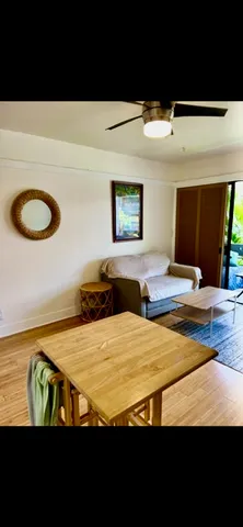 a bedroom with a bed and a night stand