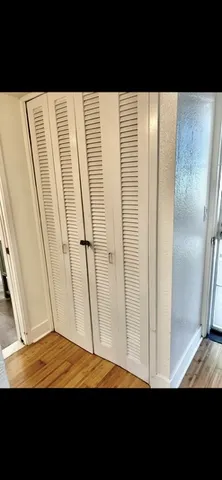 a view of balcony with wooden floor