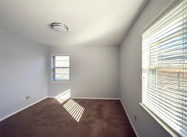 a view of an empty room and a window