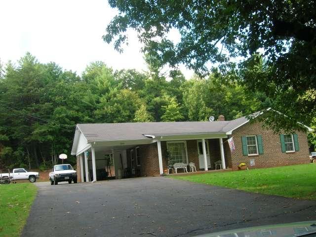2895 Old Ferrum Road Ferrum, VA 24088 - Photo 1 of 6 a front view of a house with a garden