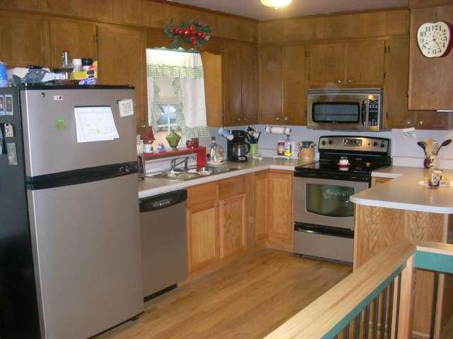 2895 Old Ferrum Road Ferrum, VA 24088 - Photo 3 of 6 a kitchen with stainless steel appliances a stove refrigerator sink and microwave