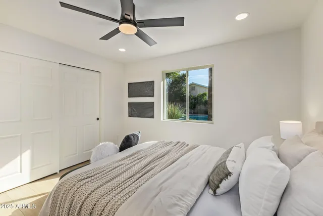 a bedroom that has a bed and a window