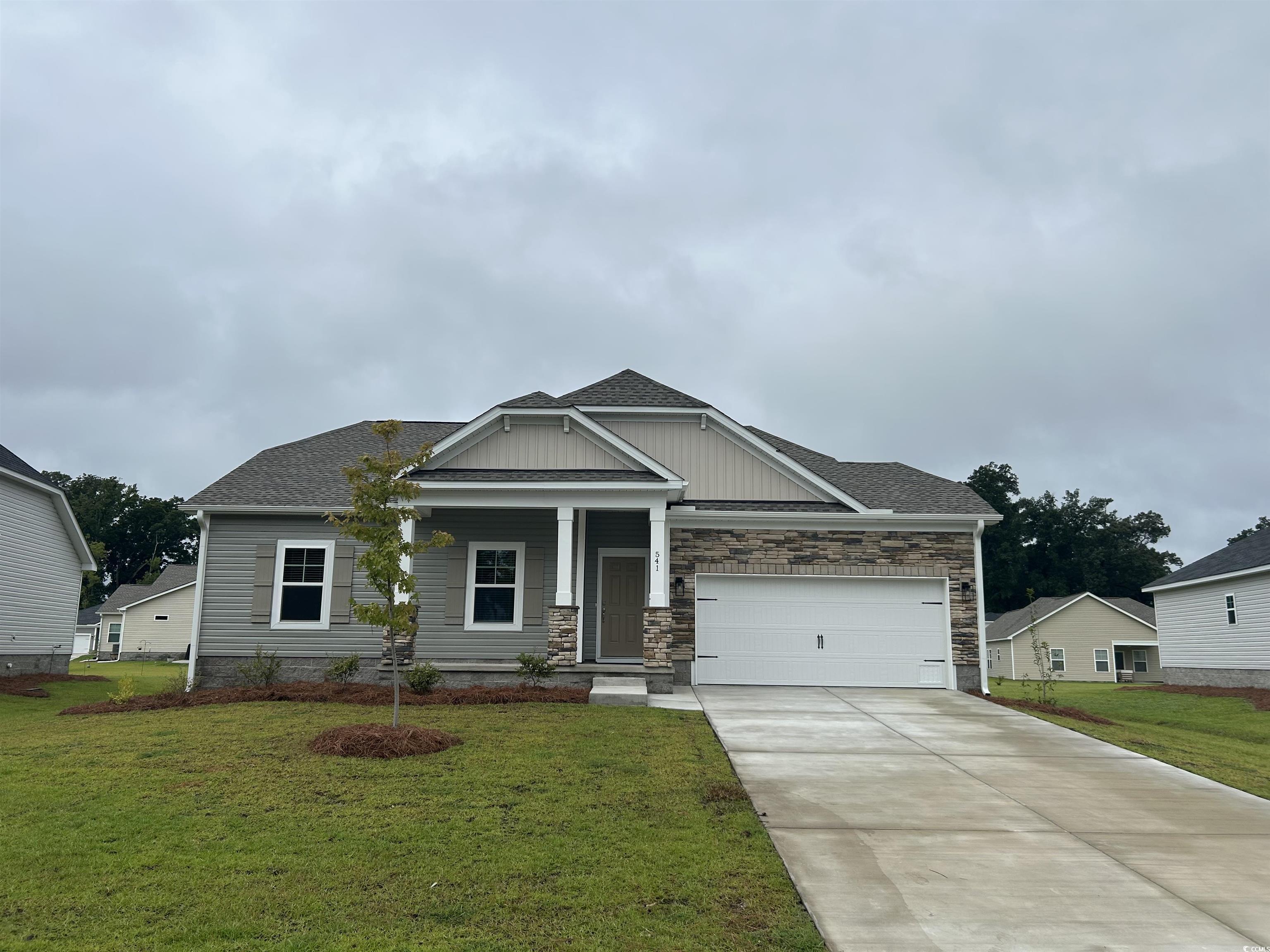 541 Honeyhill Loop Conway, SC 29526 - Photo 1 of 32 Craftsman house with driveway, a garage, a front l