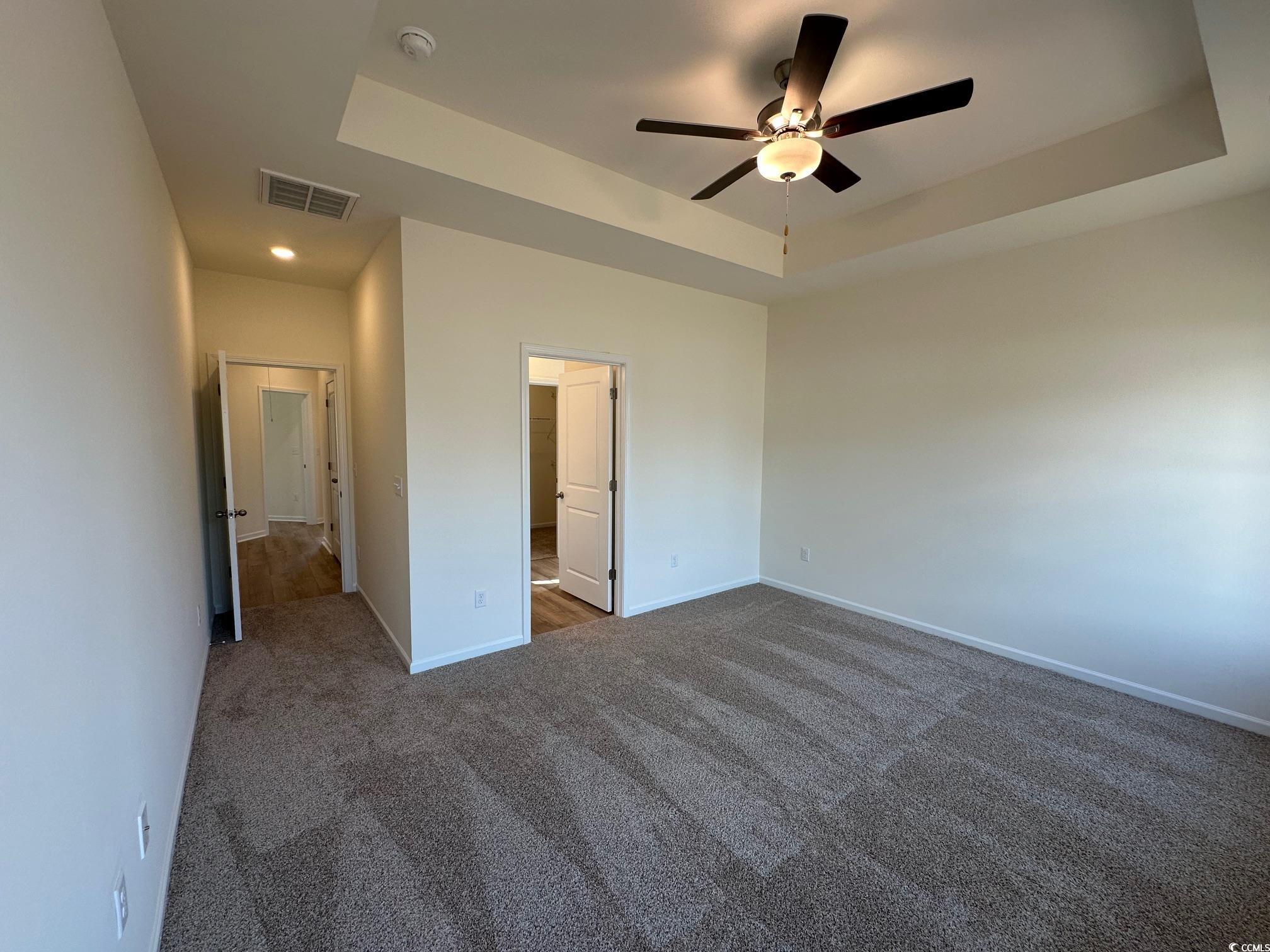 541 Honeyhill Loop Conway, SC 29526 - Photo 14 of 32 Unfurnished bedroom featuring visible vents, a rai