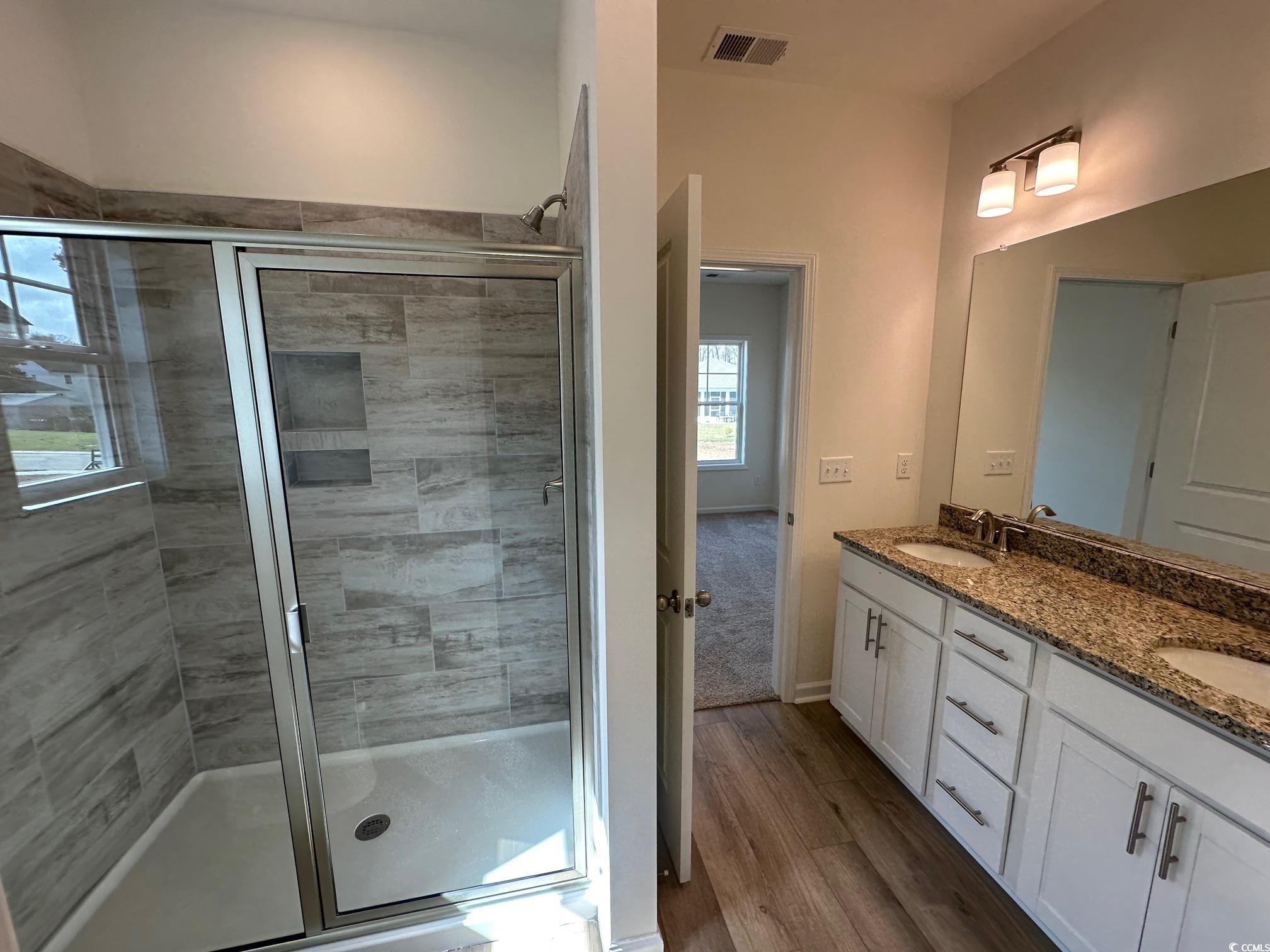 541 Honeyhill Loop Conway, SC 29526 - Photo 16 of 32 Bathroom featuring a stall shower, wood finished f