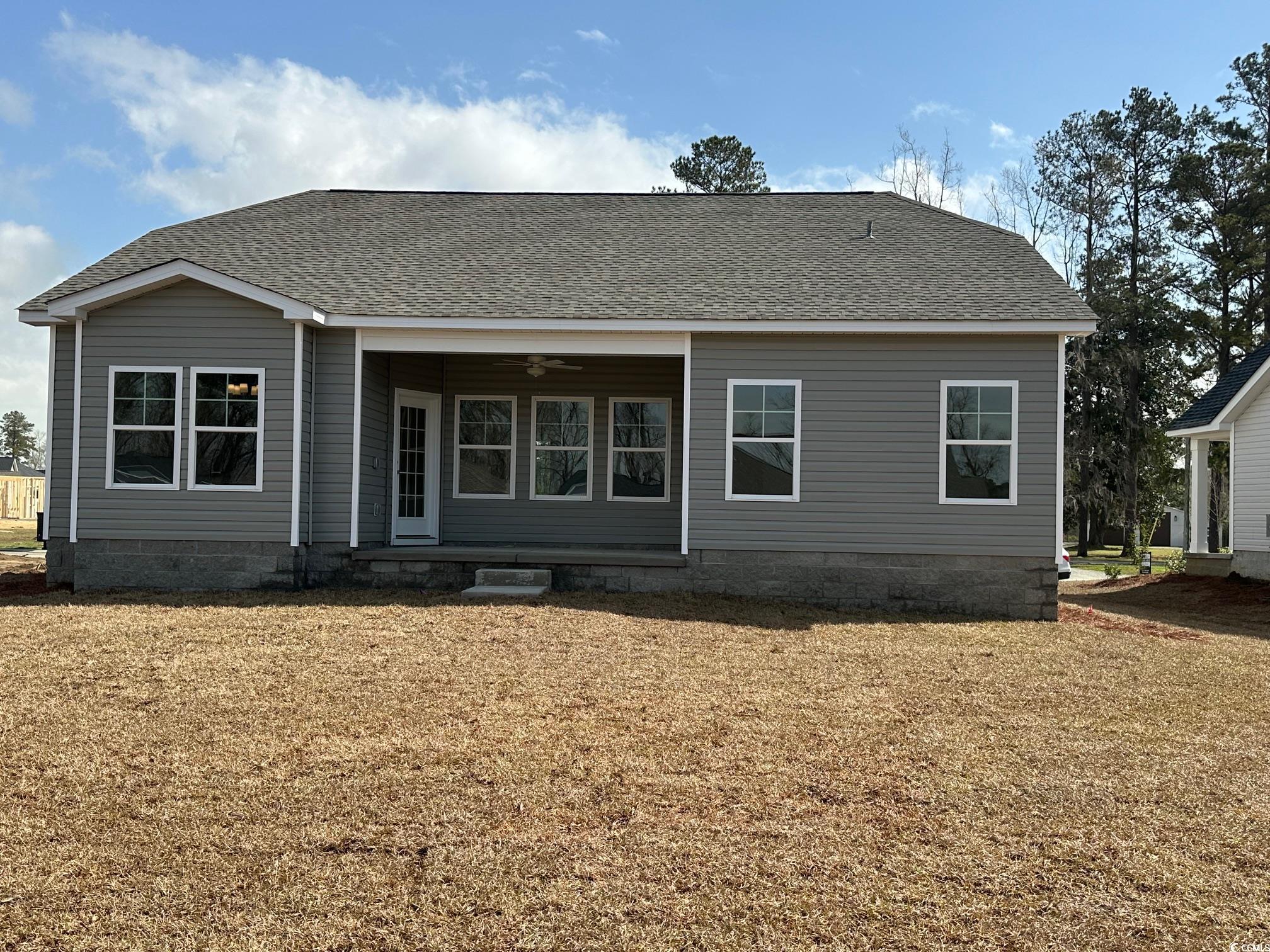 541 Honeyhill Loop Conway, SC 29526 - Photo 18 of 32 Rear view of property with a lawn, a shingled roof