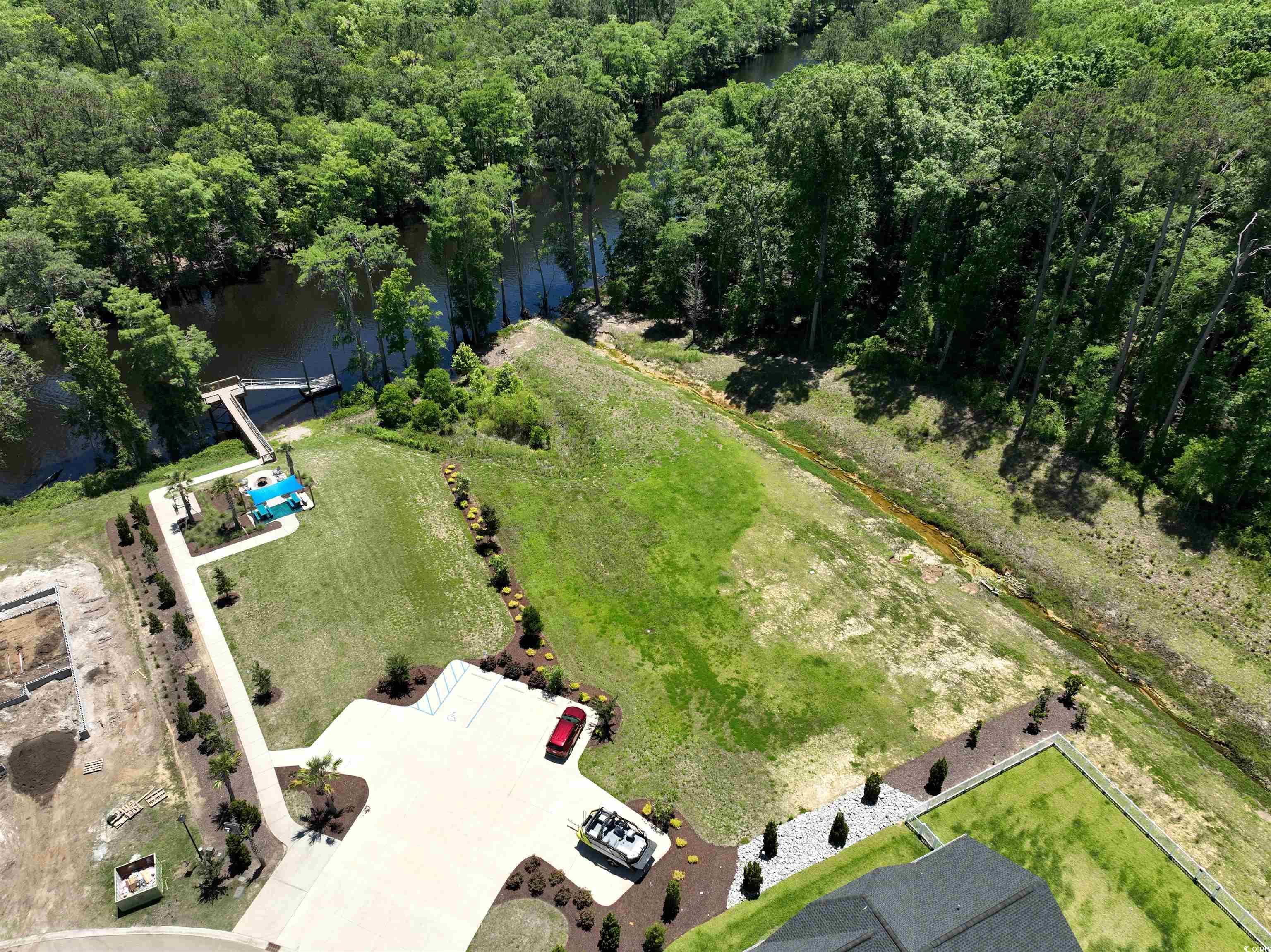 541 Honeyhill Loop Conway, SC 29526 - Photo 21 of 32 Aerial view of a nearby body of water and a forest