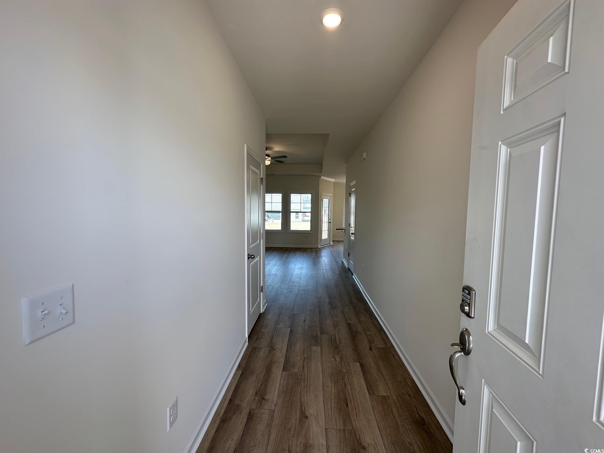 541 Honeyhill Loop Conway, SC 29526 - Photo 4 of 32 Hall featuring baseboards and dark wood-style floo