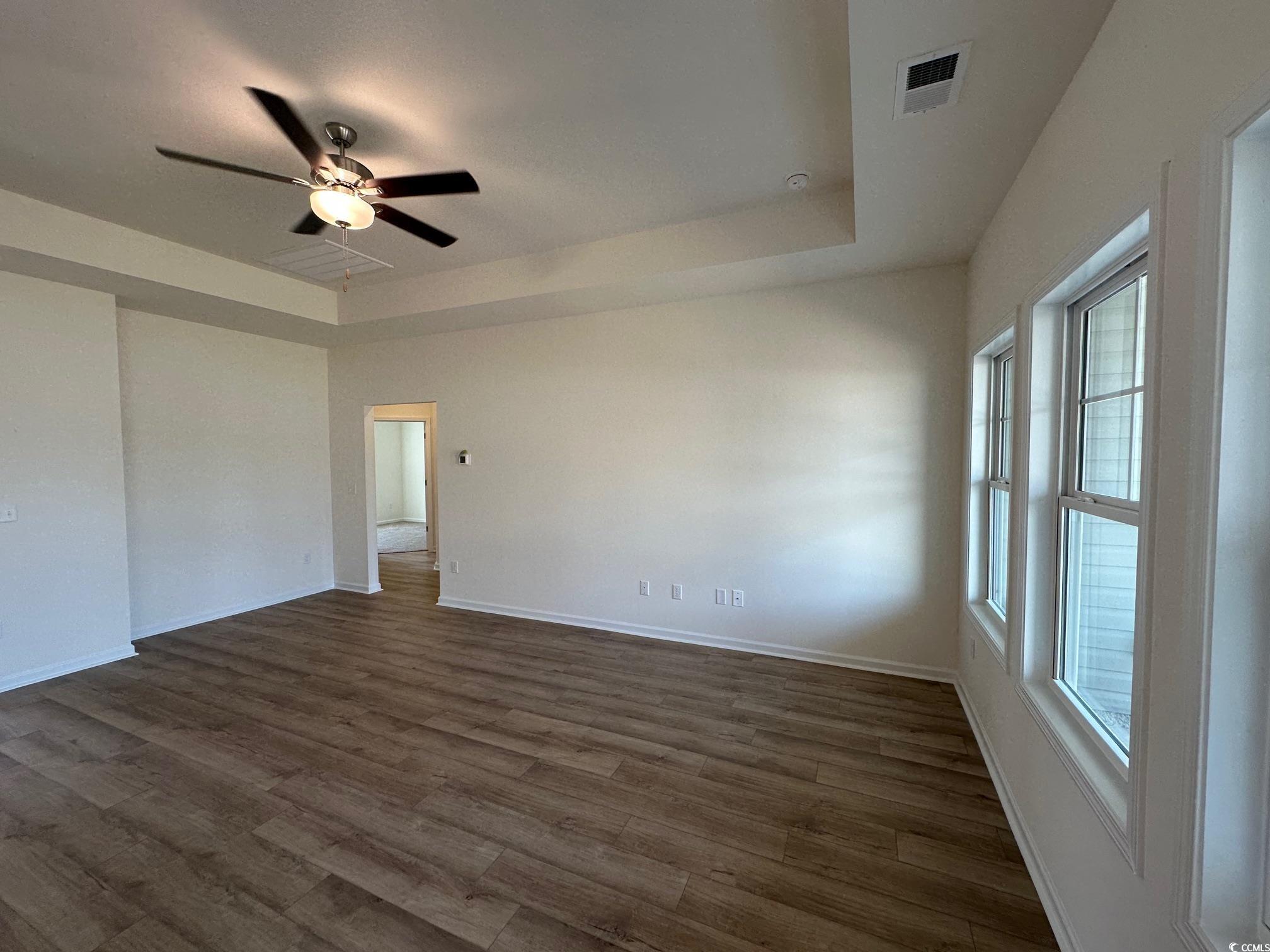 541 Honeyhill Loop Conway, SC 29526 - Photo 8 of 32 Spare room featuring a tray ceiling, baseboards, d