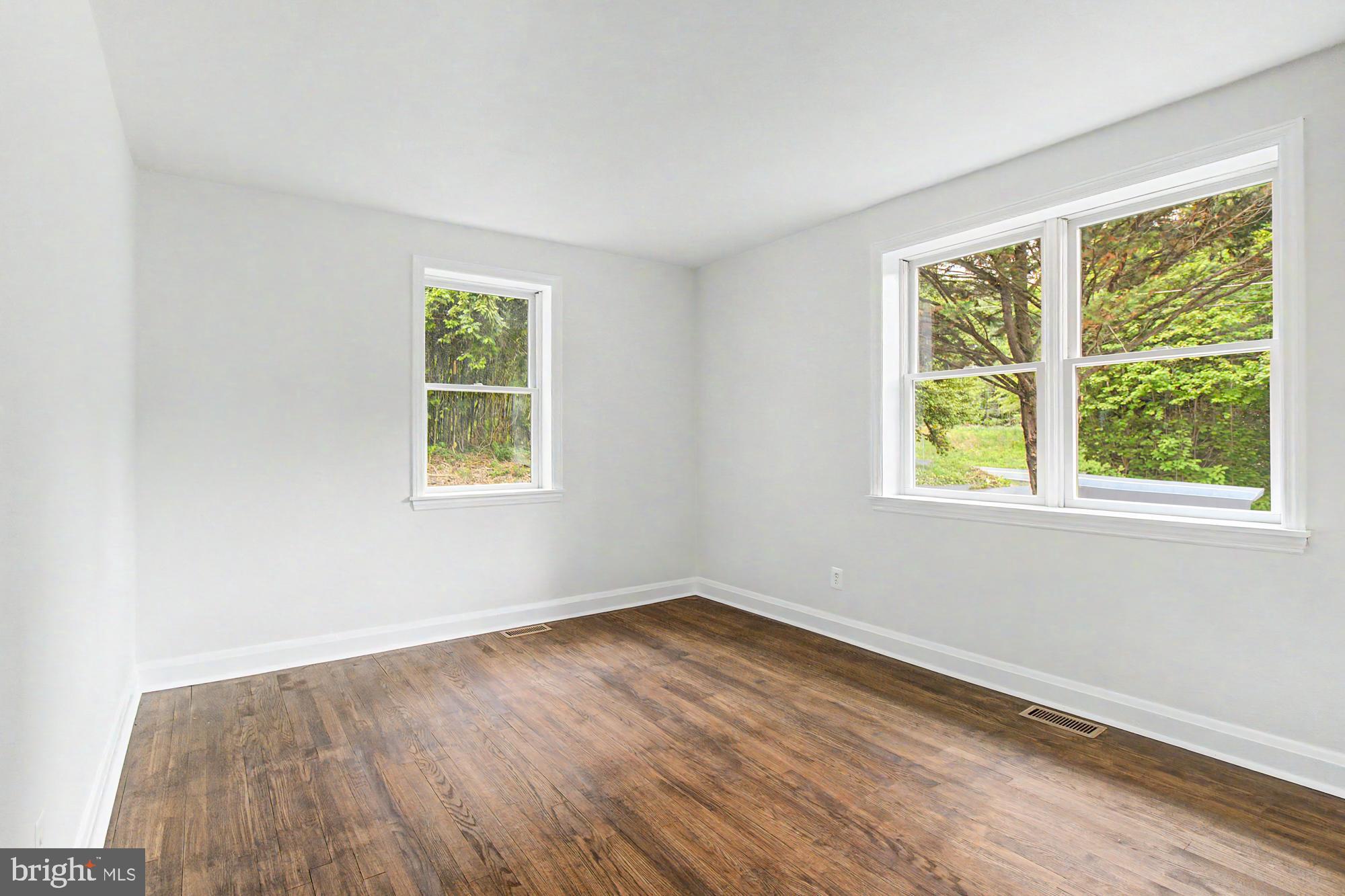 604 Prospect Mill Road Bel Air, MD 21015 - Photo 21 of 36 a view of a room with wooden floor and windows
