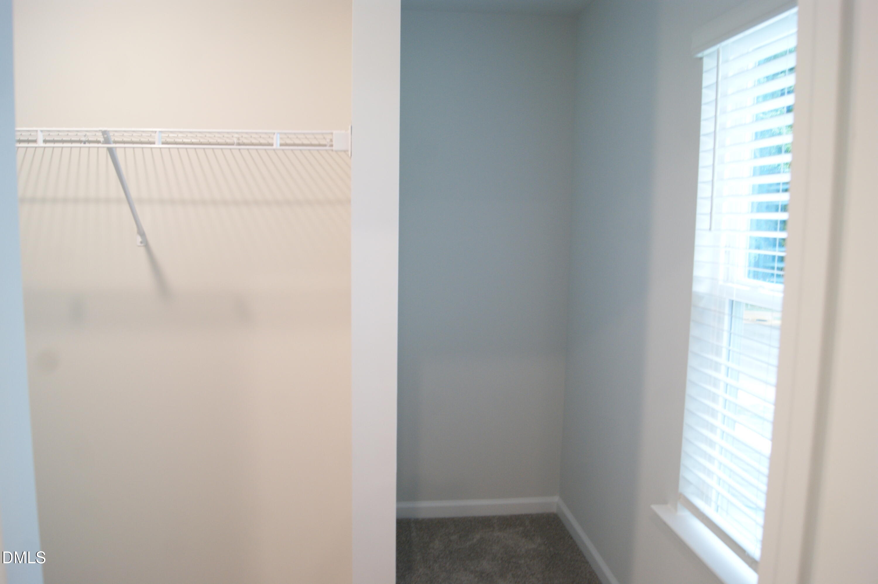 295 Glenmore Gardens Road Raleigh, NC 27603 - Photo 13 of 30 a view of a small space with racks on the wall