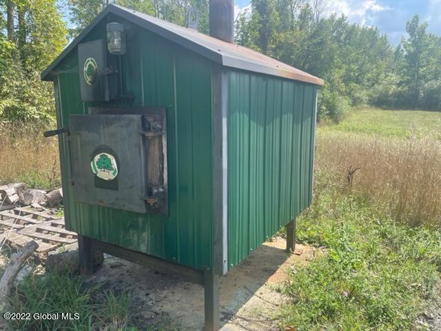 124 Jaycox Road Rensselaerville, NY 12120 - Photo 11 of 21 Outside wood stove