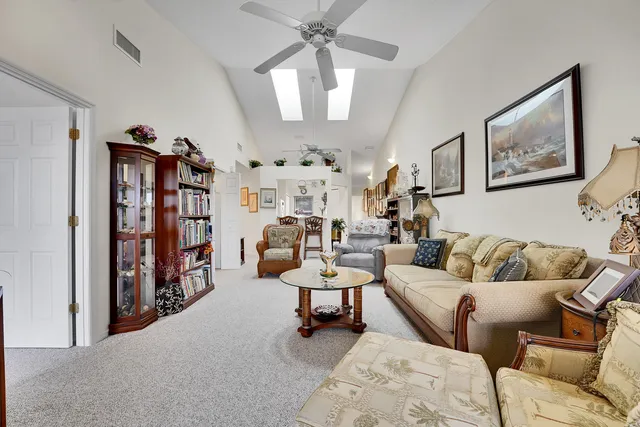 a view of a dining room with furniture and window