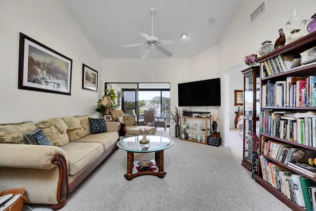 a dining room with furniture and a book shelf