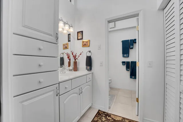 a bedroom with a bed and a desk