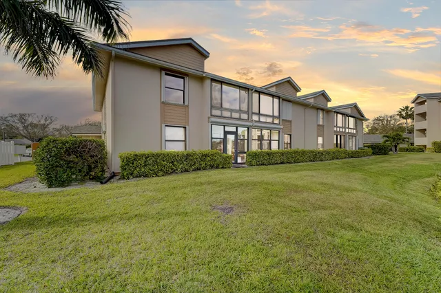 a view of a swimming pool with a yard