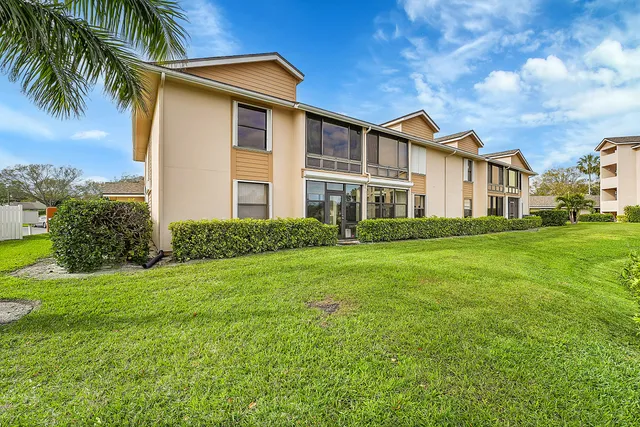 a outdoor space with a large window and sitting area