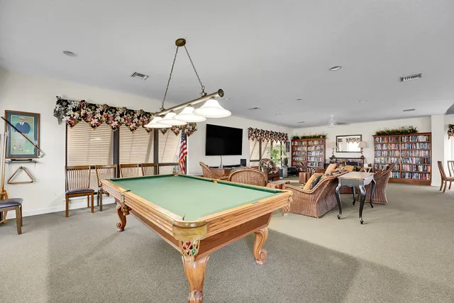 an aerial view of a house with a lake view