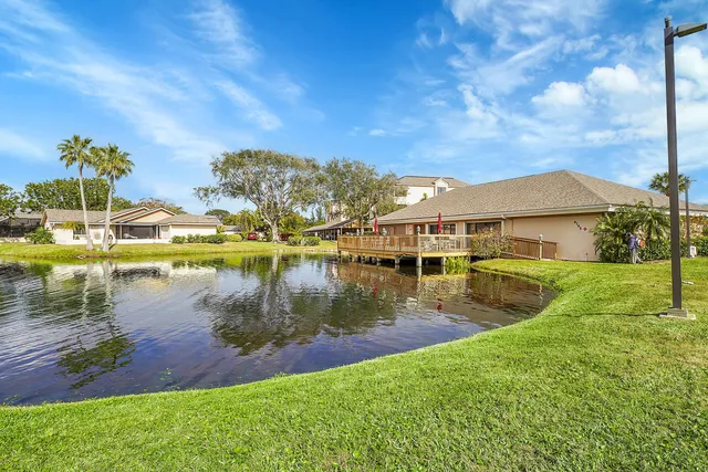 an aerial view of a house with a yard basket ball court and outdoor seating