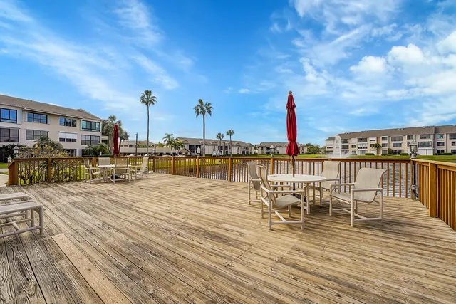 a view of swimming pool with outdoor seating