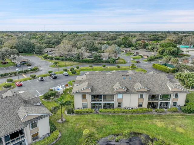 an aerial view of a house with a ocean view